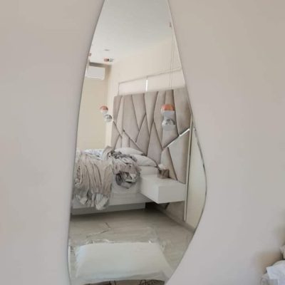 Freeform organic shaped frameless designer mirror in luxury bedroom — Mirror Art Gallery JHB Johannesburg